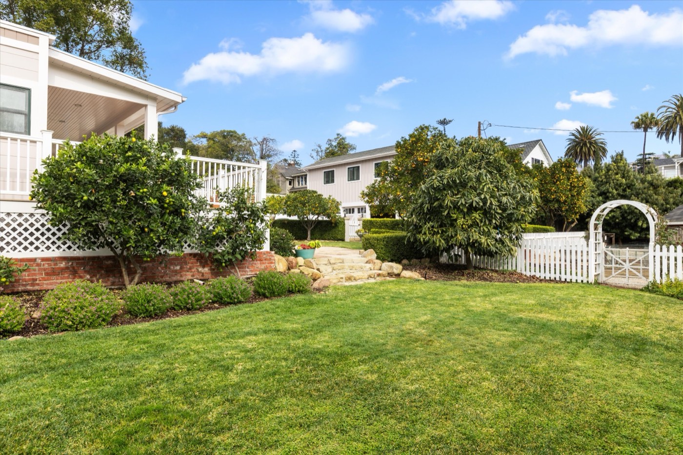 Lawn, picket fence and garden arbor